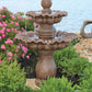 A tiered stone fountain from Massarelli's. Water flows from the upper level and falls gracefully in the 2-Tier fountain base.