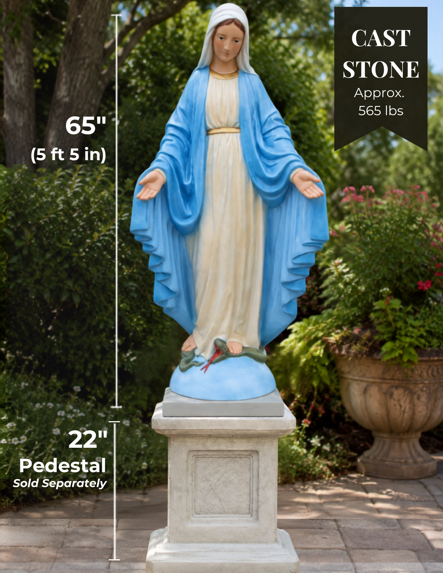 A cast stone statue of the Virgin Mary on a pedestal, shown outdoors in a garden setting. The statue features a blue robe and white gown, with a white head covering.