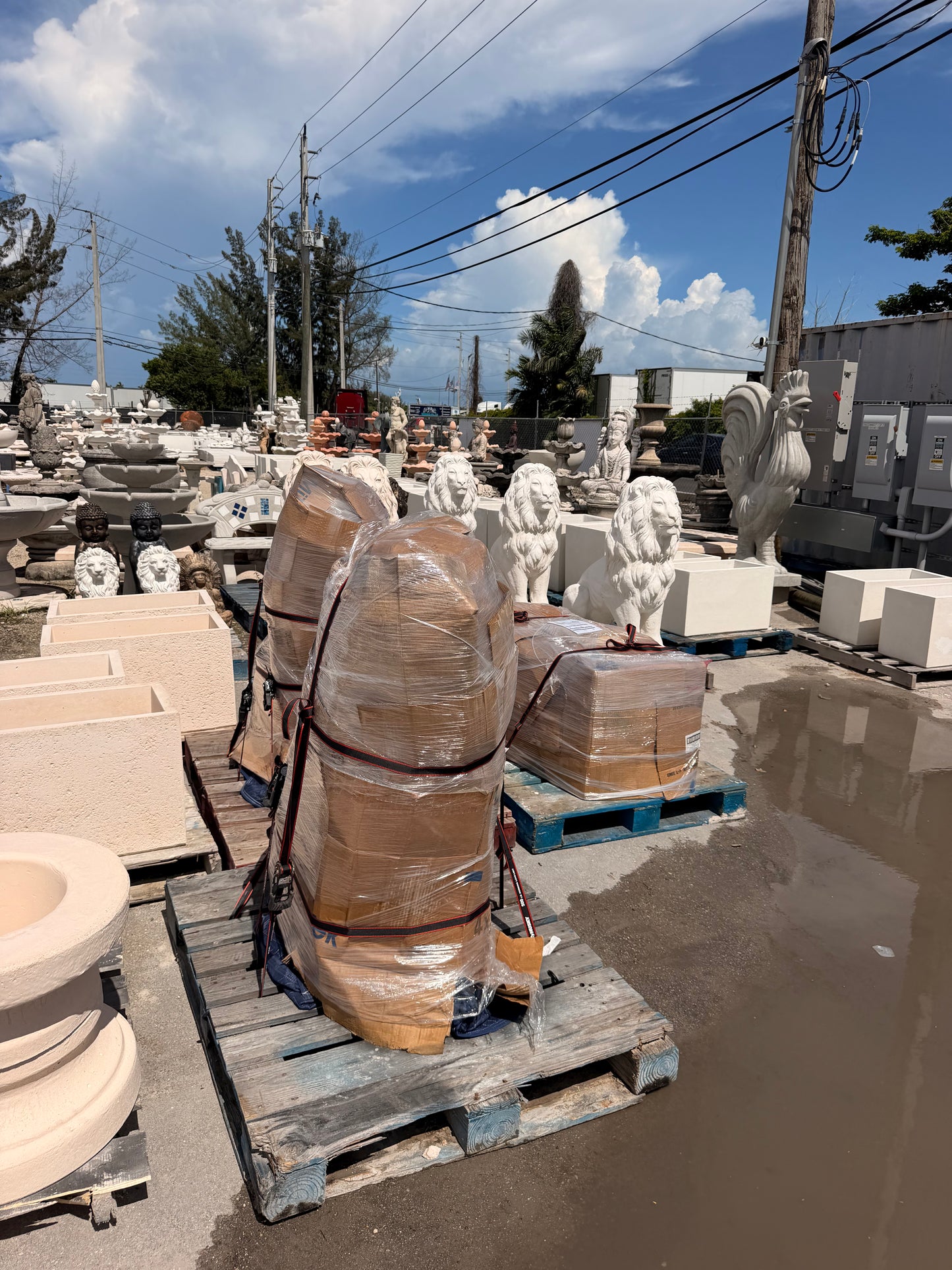 Large concrete lion statue packaged for freight delivery
