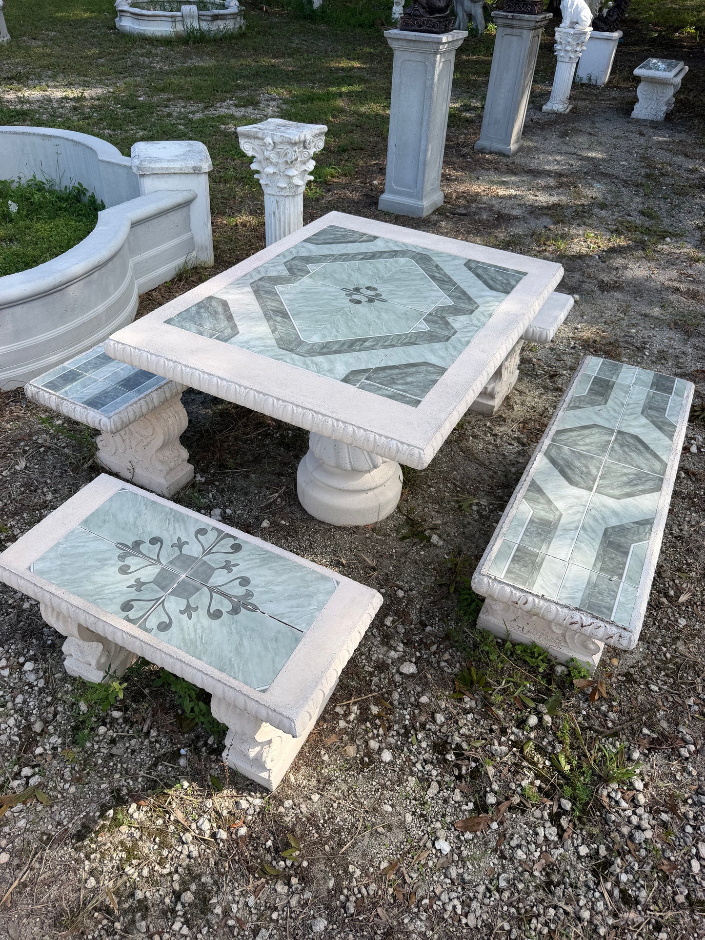 Hand Cast Outdoor concrete table set complete with four benches and beautiful mosiac tile | CB Stone Decor 