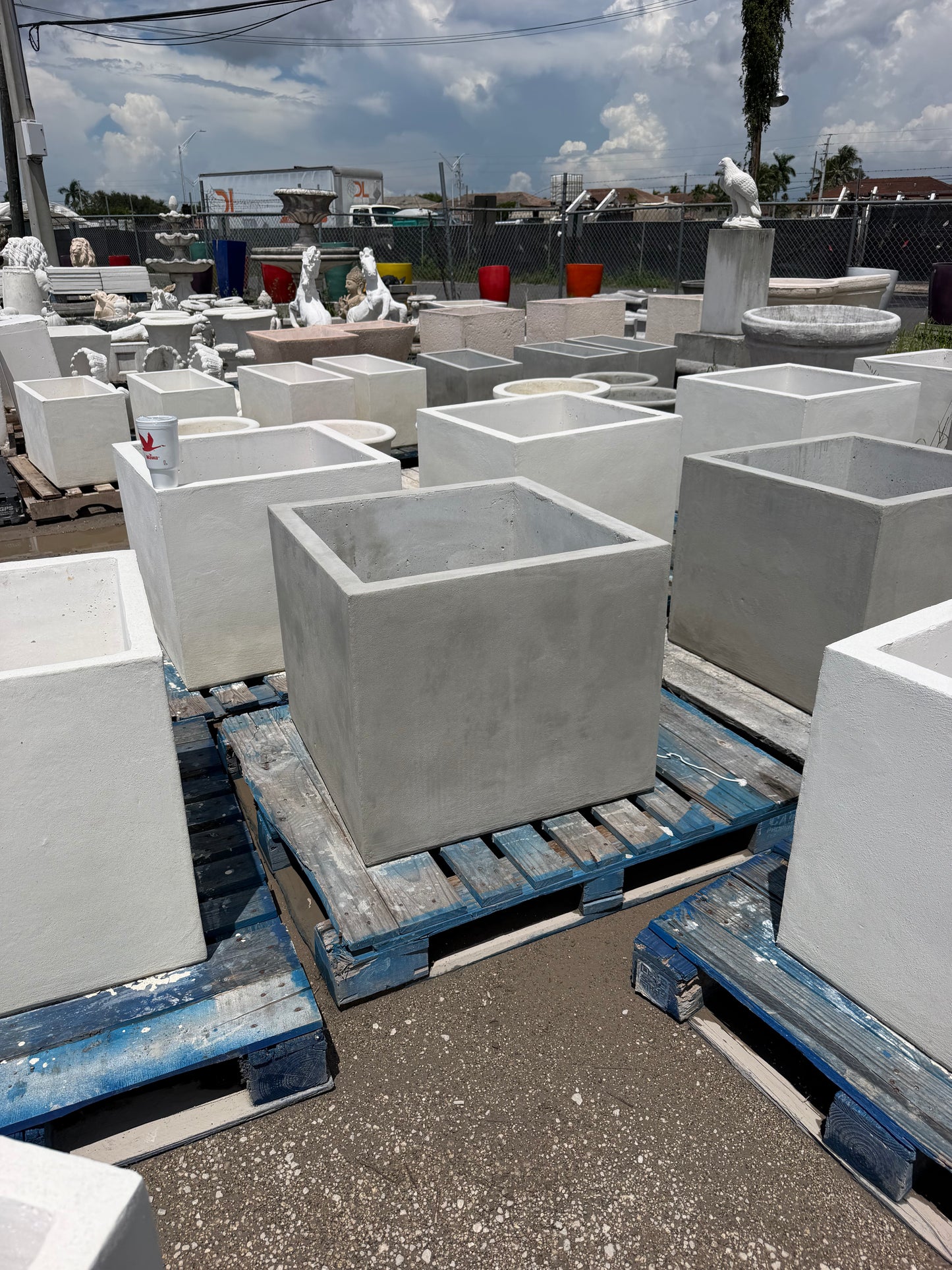A medium square concrete planter in a gray finish - CBSD